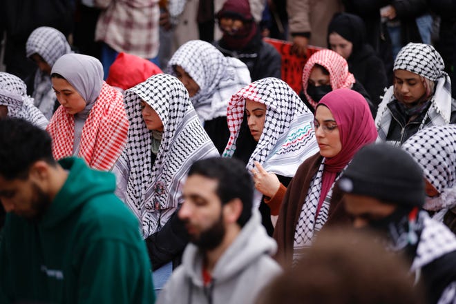 Pro-Palestinian protesters pray outside of Columbia University in New York City on April 18, 2024. Officers cleared out a pro-Palestinian campus demonstration on April 18, a day after university officials testified about anti-Semitism before Congress. Leaders of Columbia University defended the prestigious New York school's efforts to combat anti-Semitism on campus at a fiery congressional hearing on April 17.